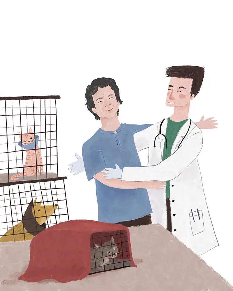 Man with sick cat at vet